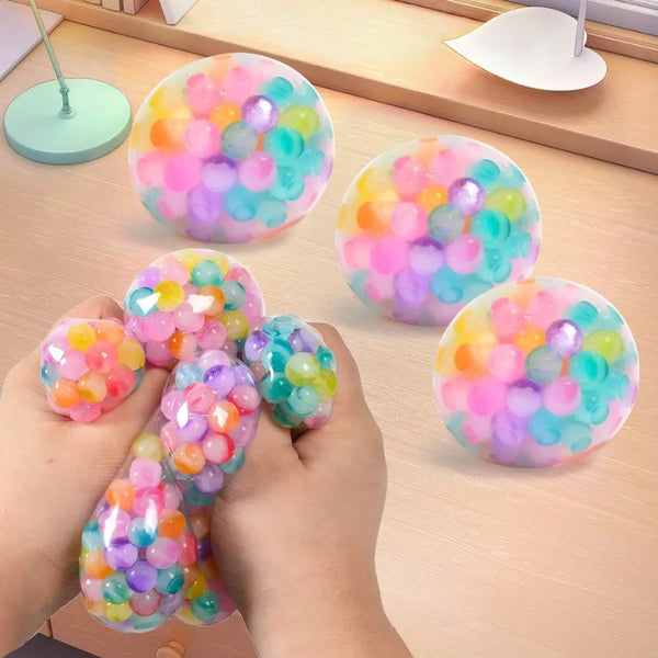Hands holding and playing with colorful bubble squishy toys