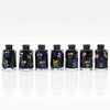 A set of seven floral resin potion bottles with numbered dice inside, displayed in a row.
