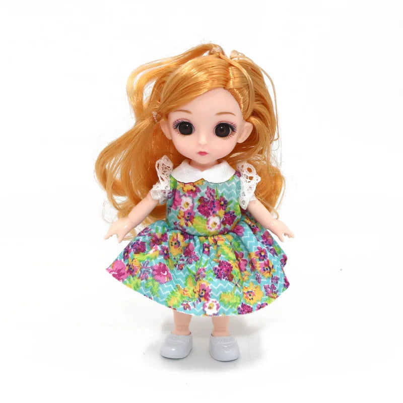An orange-haired Ball-Jointed Doll princess with a floral dress and white lace collar.