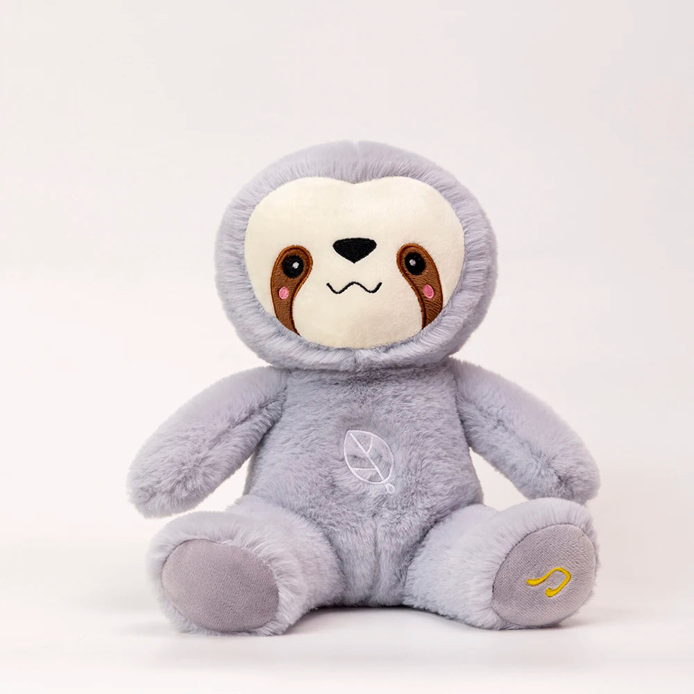 A soft gray sloth plush toy with brown markings sitting on a white surface.