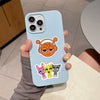 A light blue phone case featuring decorative stickers of cartoon animals.