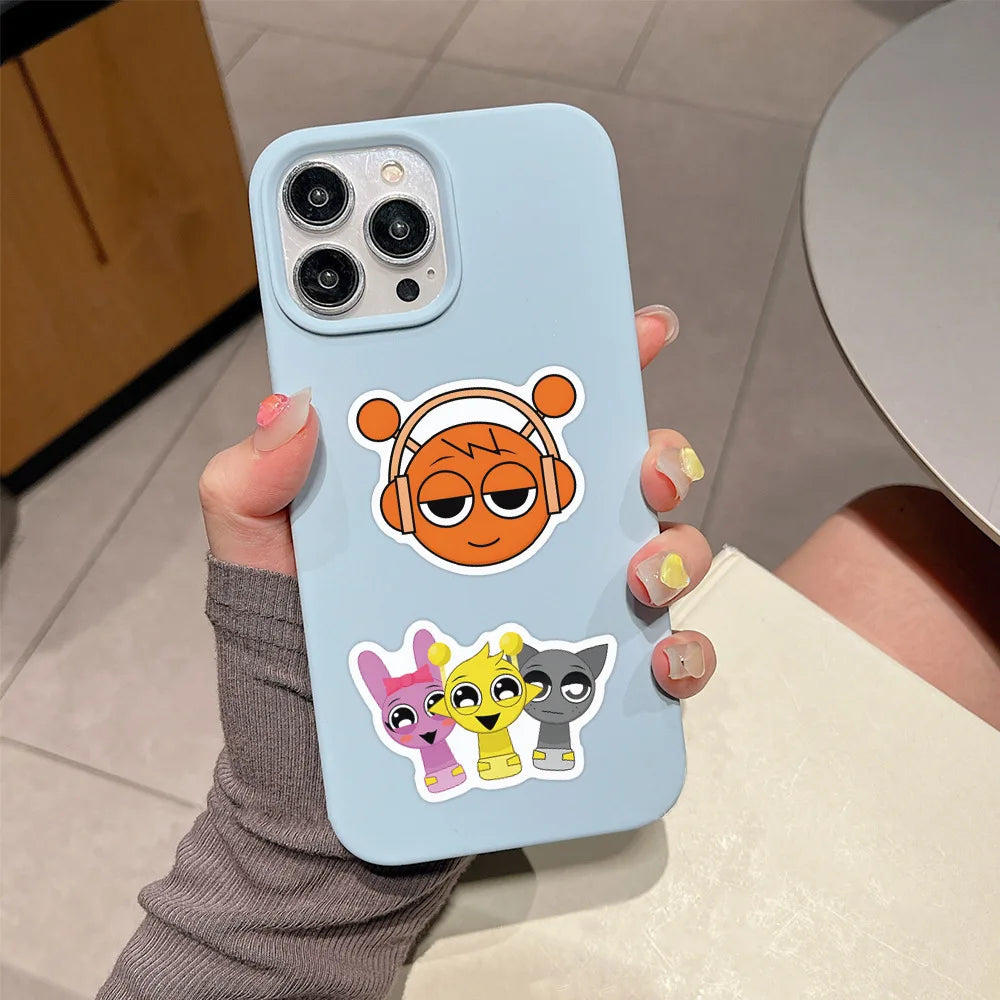 A light blue phone case featuring decorative stickers of cartoon animals.