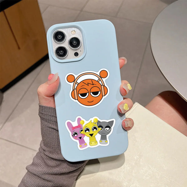 A light blue phone case featuring decorative stickers of cartoon animals.