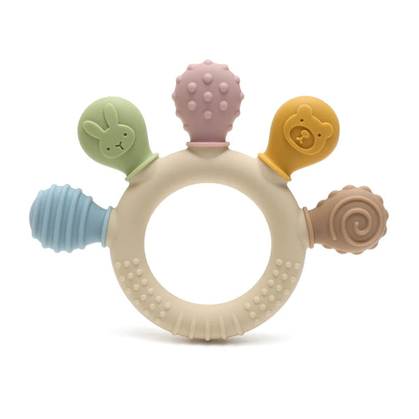 A set of silicone baby teether rings in pastel colors including green, purple, and yellow.