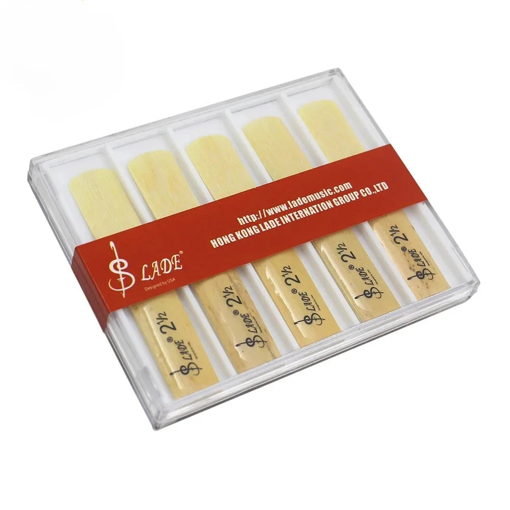 A plastic box containing a pack of ten yellow clarinet reeds labeled as Premium Bb Clarinet Reeds