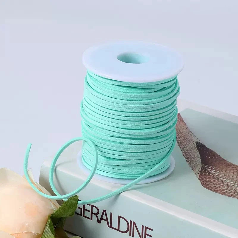 A roll of light mint green velvet faux suede braided ribbon for crafting and gift wrapping