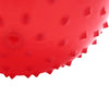 Close-up view of a bright red inflatable sensory ball with textured spikes.