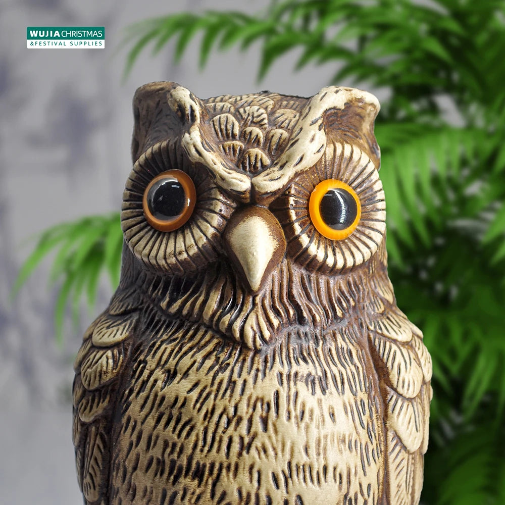 A realistic owl garden statue bird deterrent decor with brown and tan feathers.