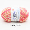 A ball of pink and yellow striped yarn labeled as Jane cotton yarn for knitting and crochet