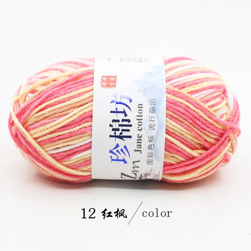 A ball of pink and yellow striped yarn labeled as Jane cotton yarn for knitting and crochet