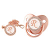 Rose gold bling baby pacifier clip featuring a silicone holder and a decorative rose gold design.