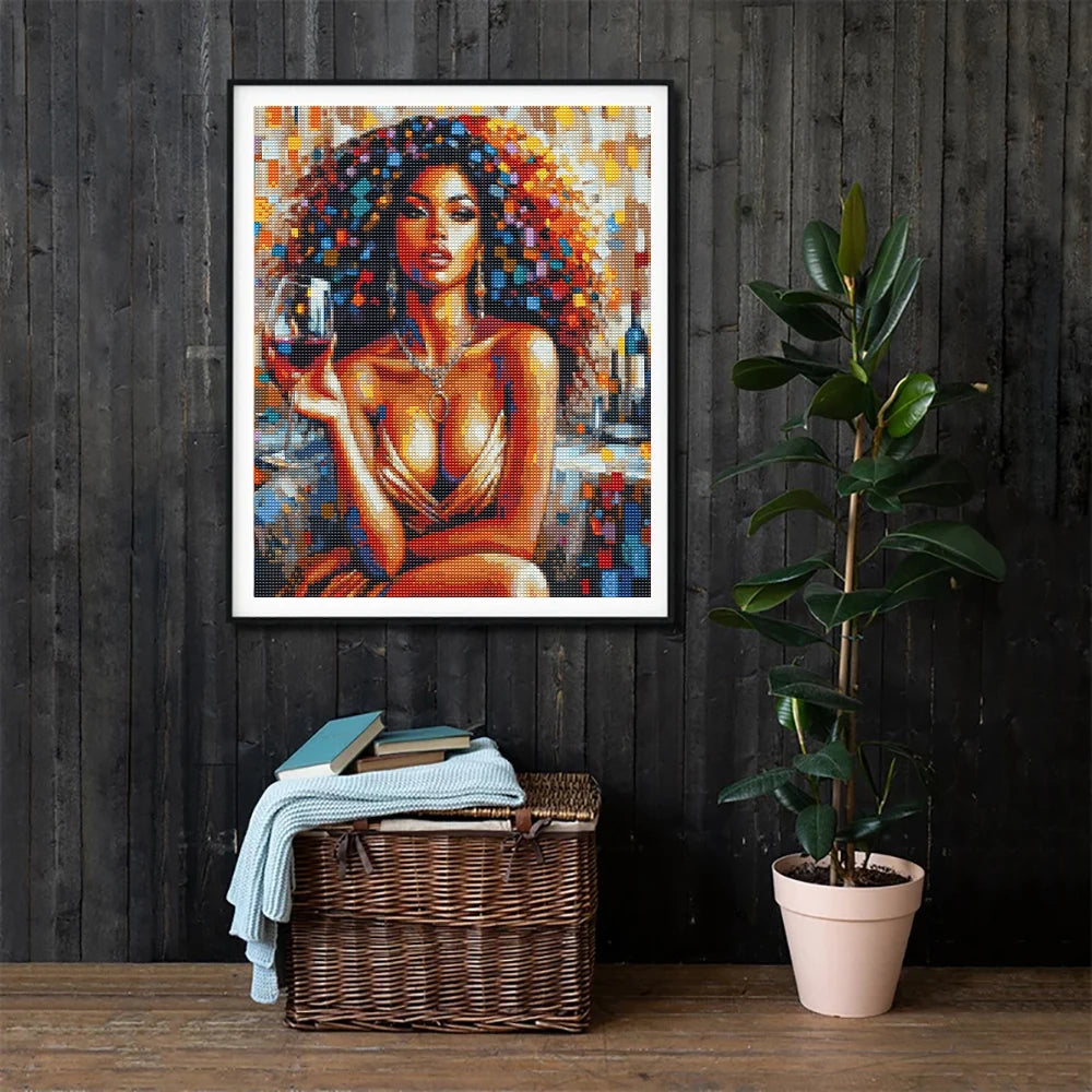 A diamond painting kit featuring a portrait of an African woman with curly hair and red wine.