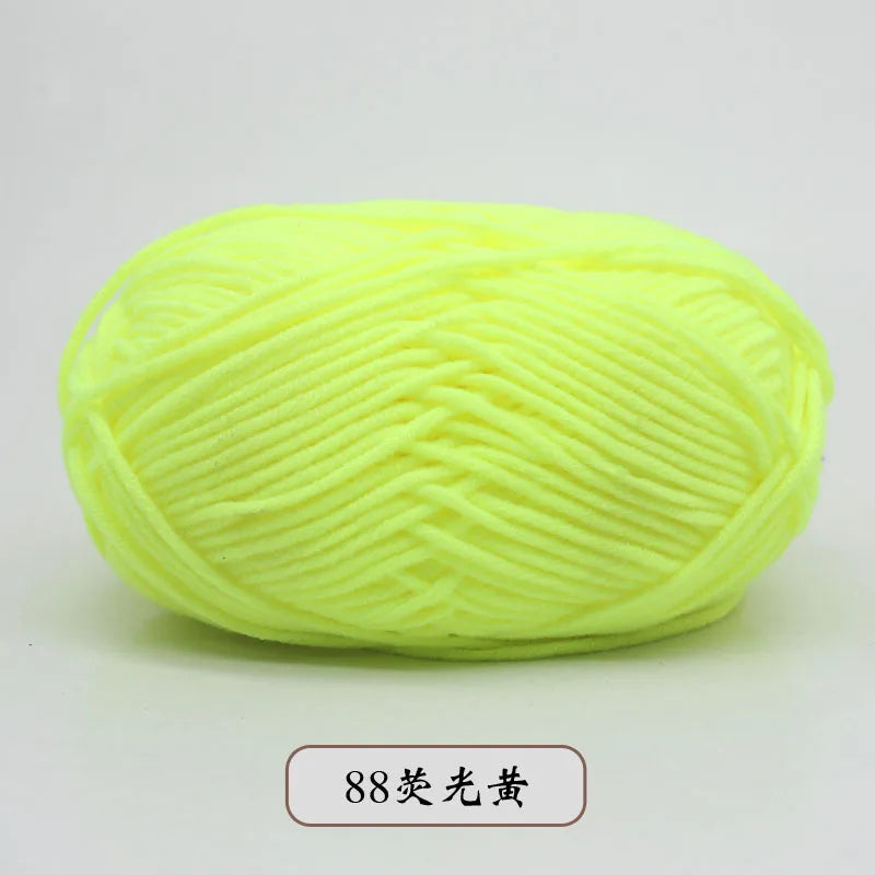 A ball of bright yellow pre-dyed milk cotton yarn for knitting and crochet.
