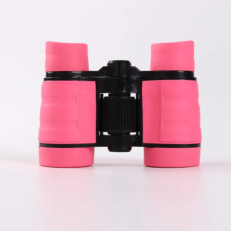 A pair of bright pink binoculars with black accents, designed for birdwatching and outdoor adventures.