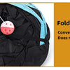 A black and blue foldable cat tunnel is shown with a pink hanging ball toy inside.