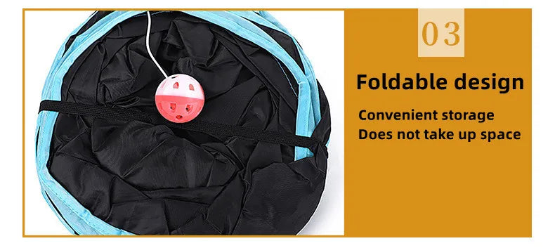A black and blue foldable cat tunnel is shown with a pink hanging ball toy inside.
