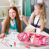 A pink kids makeup kit for girls with various cosmetic tools and shades displayed on a white table.
