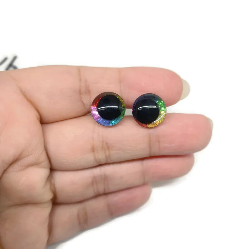 Pair of glitter cartoon safety eyes with iridescent and colorful accents for dolls and plush crafts
