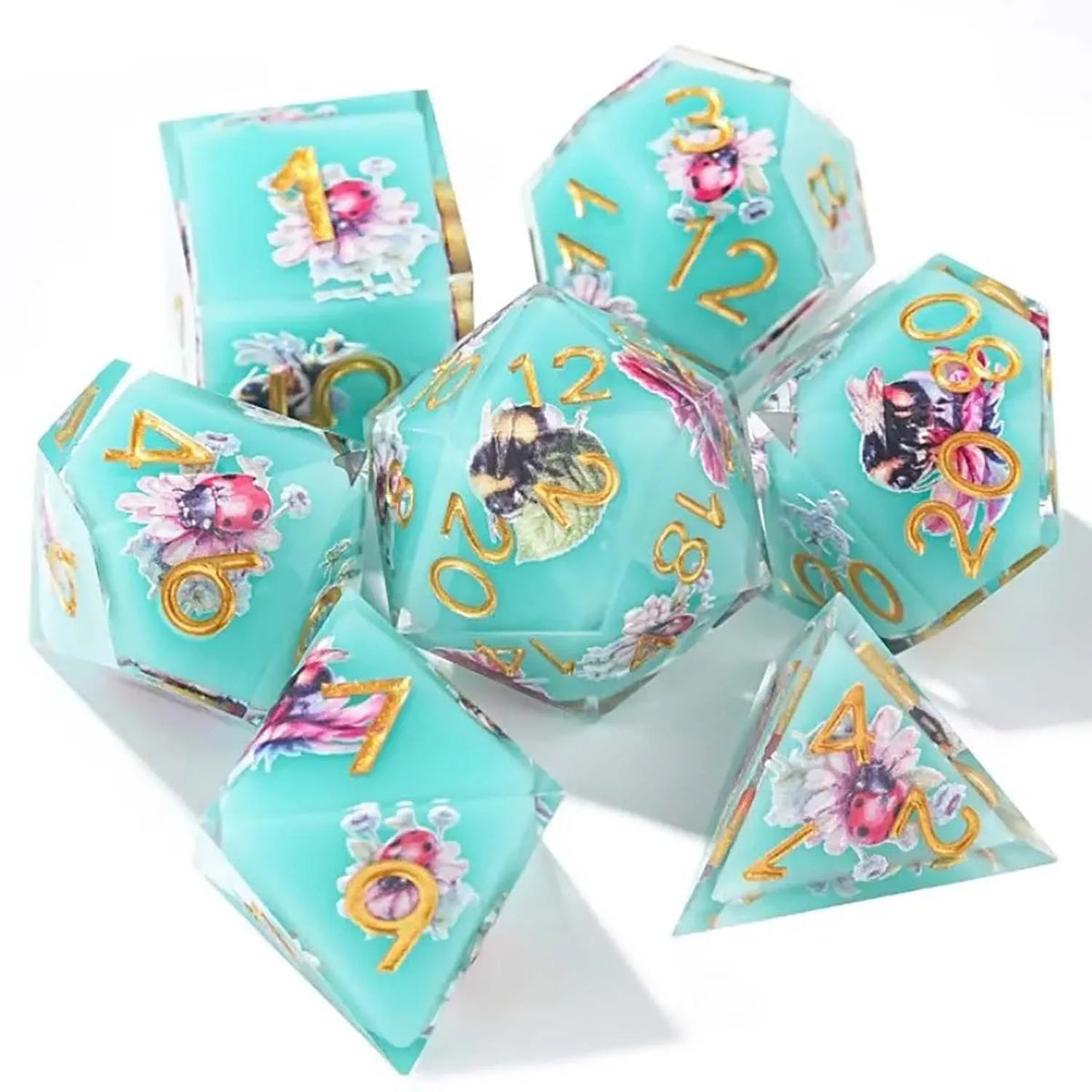 A set of seven pink floral butterfly resin polyhedral dice for tabletop role-playing games