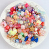 A colorful assortment of iridescent acrylic bow and flower beads for DIY jewelry making