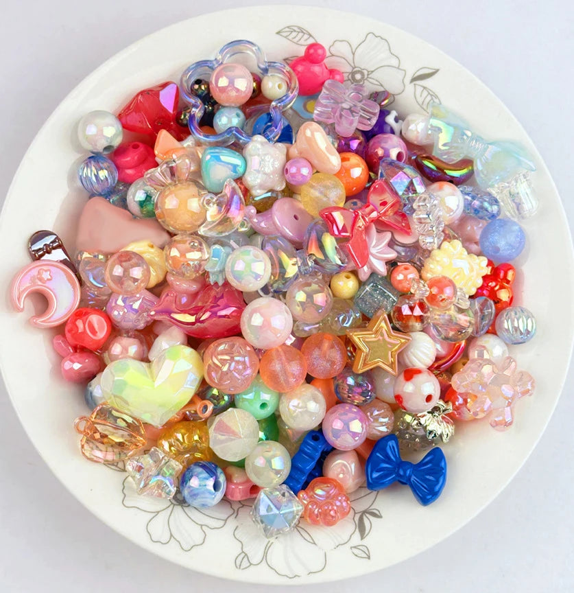 A colorful assortment of iridescent acrylic bow and flower beads for DIY jewelry making