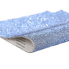 Blue sparkling rhinestone adhesive tape rolled up for DIY crafts and decor