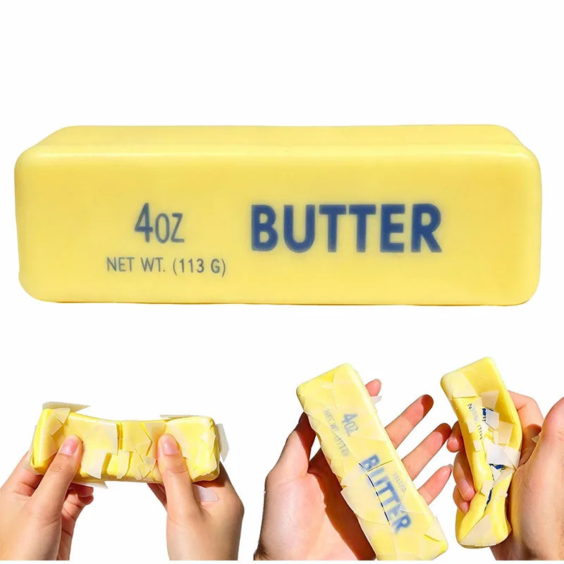 A yellow plastic container of butter with a 4oz net weight label and hands holding pieces of the butter.
