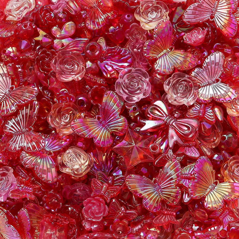 Close-up of vibrant red and pink butterfly shell acrylic beads for DIY jewelry making