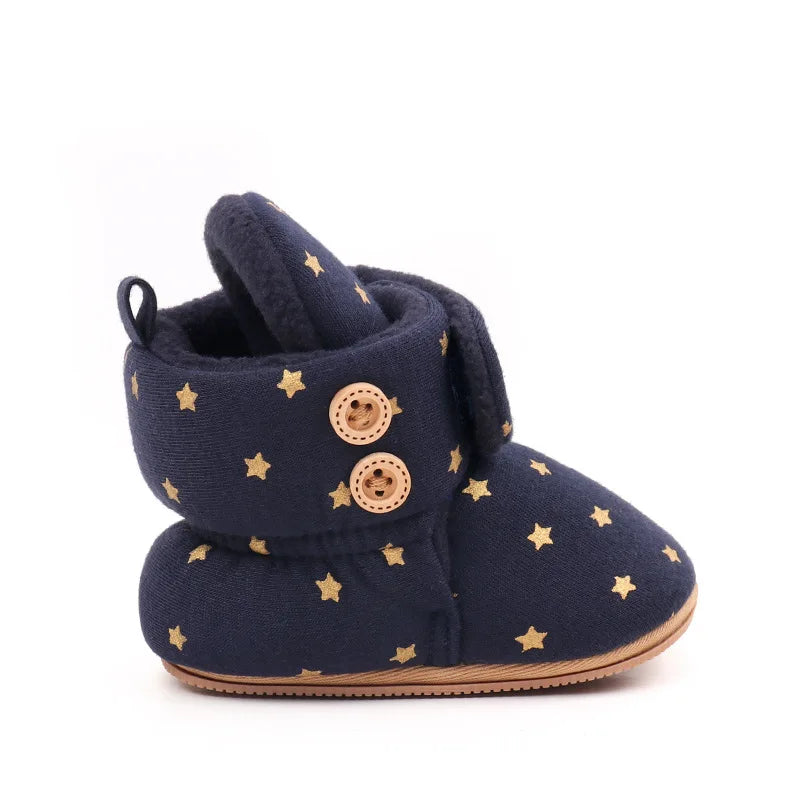 Navy baby winter snow boots with fuzzy ball accents and gold stars