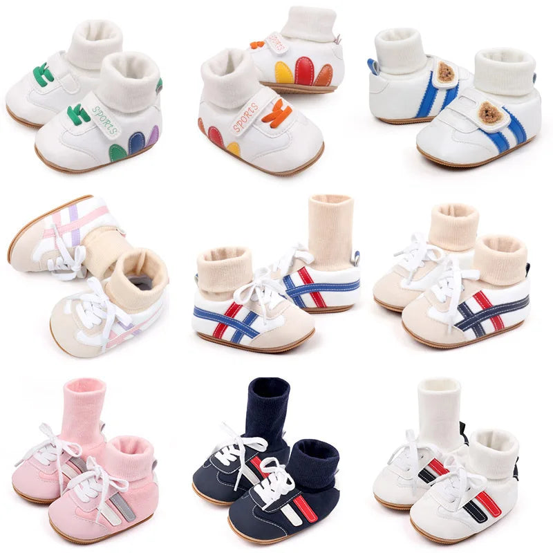 A collection of white and pink baby booties with anti-slip soles shown from various angles.