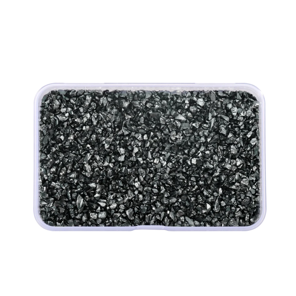 A clear plastic container filled with black crushed glass stones for resin and craft projects.