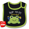 A green cartoon frog baby feeding bib with a black background and light green trim.