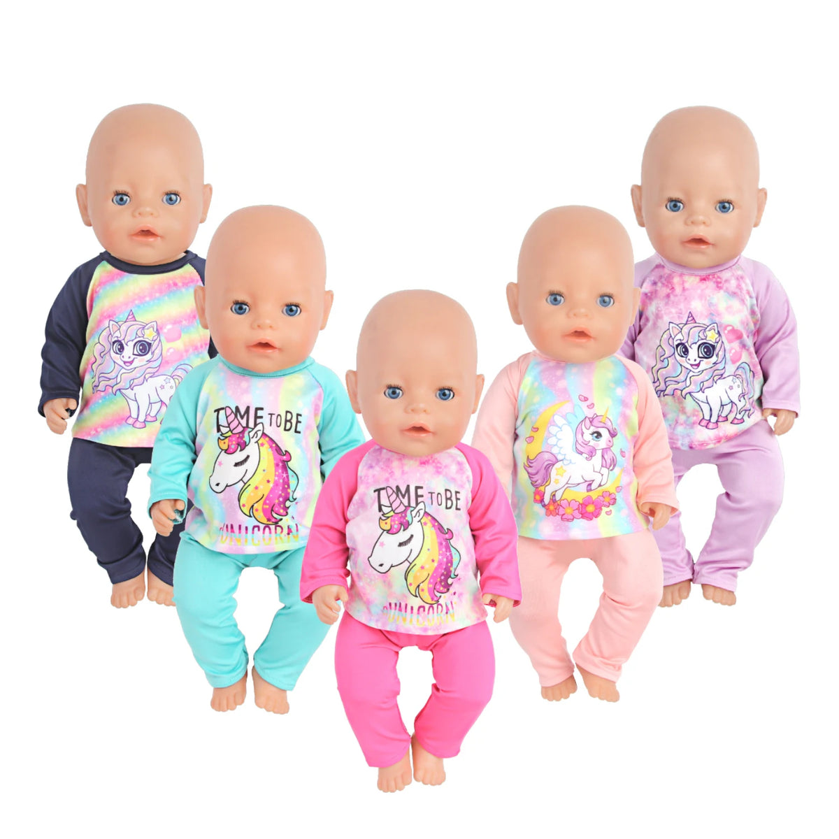 Four baby dolls wearing unicorn pajama sets in various colors and styles