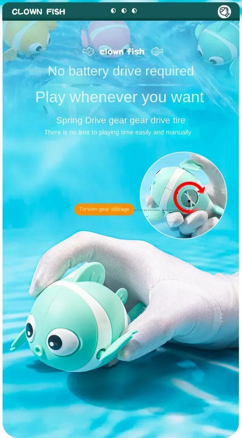 A hand is holding a light green wind-up swimming duck bath toy for toddlers.