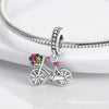 Sterling silver charm bead pendant featuring a bicycle, key, and other charms attached to a silver chain.