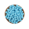 A wooden bowl filled with numerous small, light blue silicone round beads for jewelry making.