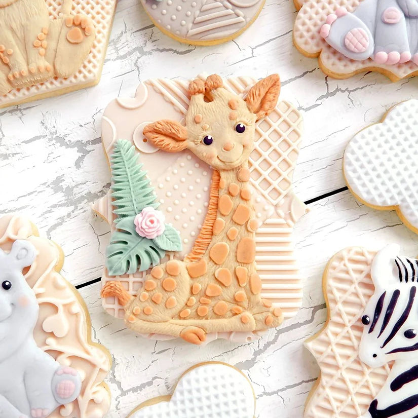 A collection of elephant silicone baking molds for cookies and cupcakes featuring various colors and textures.
