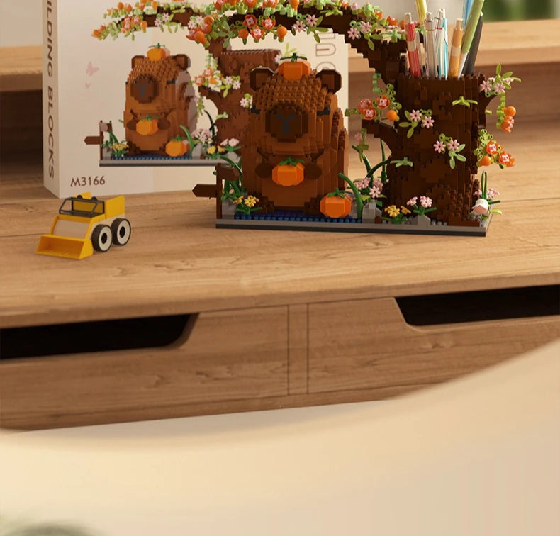 A building block pen holder and desk organizer featuring a brown bear tree with orange fruit and small pink flowers, next to 