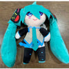 A cute plush doll of Hatsune Miku with teal hair and a blue outfit.