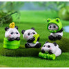 A set of adorable resin panda figurines, including a standing panda and a sitting panda, displayed on green grass.