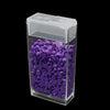 A clear plastic storage box filled with purple sequins or beads for diamond painting, featuring an organizer tray.