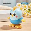 A blue ceramic wind-up chick toy with yellow feet is shown on a wooden surface.