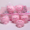 Pink squishy pig stress relief toys packaged in clear plastic bags