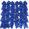 A pack of twelve blue glitter sequin pigtail bows for girls with elastic hair ties.