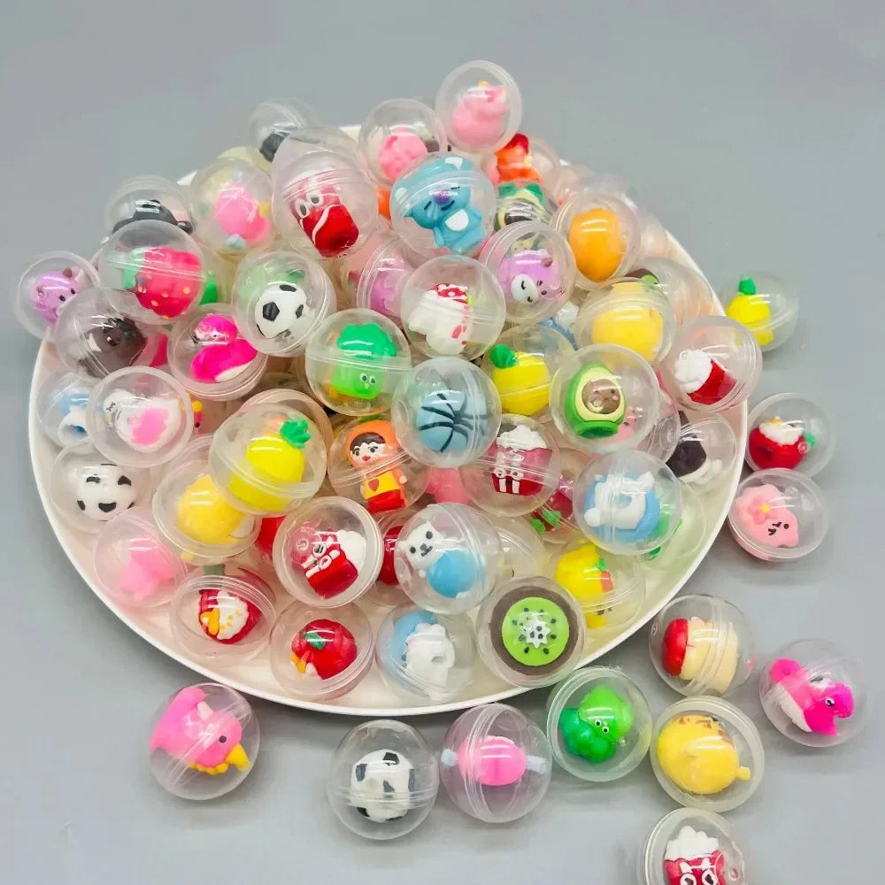 A pile of transparent plastic eggshell party favors in various bright colors like pink, yellow, green, and blue.