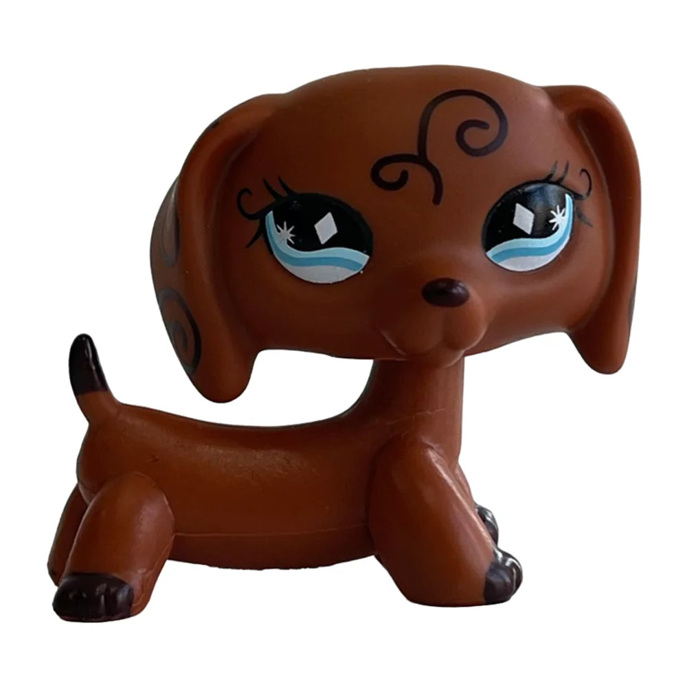 A brown bobblehead toy of a deer with large blue eyes and swirling markings.