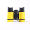 A pair of yellow and black binoculars for birdwatching and outdoor adventures.
