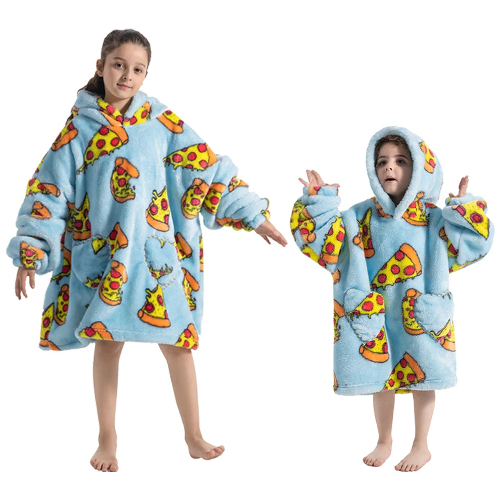 A young girl wearing a light blue fuzzy hoodie sweater with yellow and orange fruit patterns.