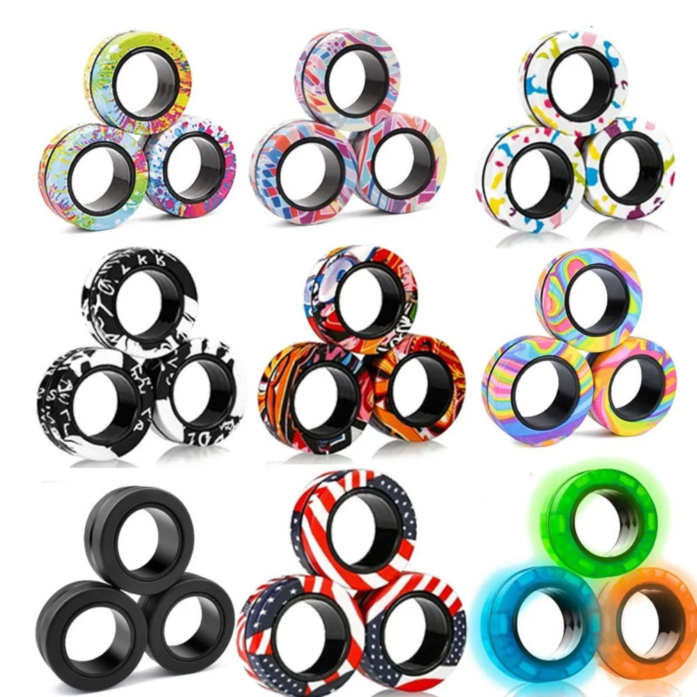 A collection of magnetic fidget spinning rings in various colors and patterns for stress relief.