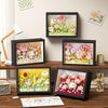A set of 3D flower building blocks displayed on a framed board for a DIY craft kit.